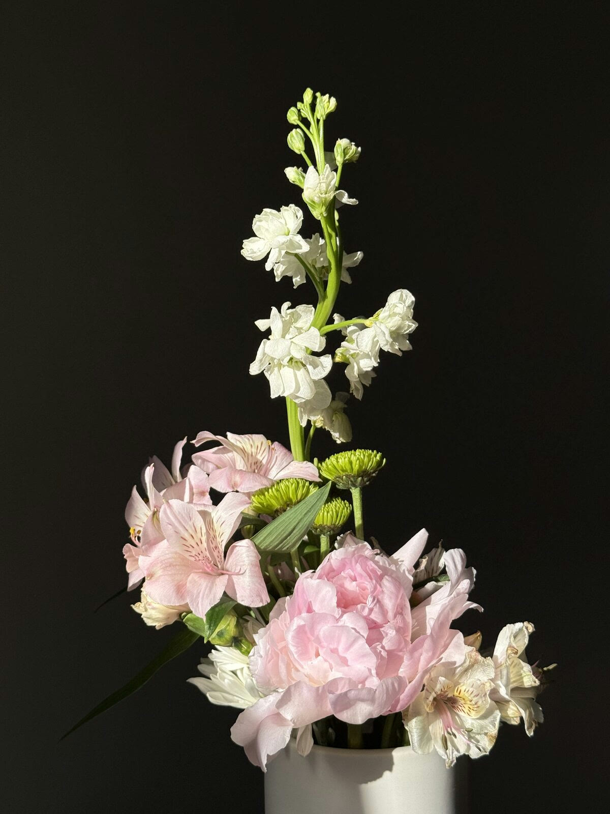 Pink and white seasonal floral arrangement by Olivia Piro